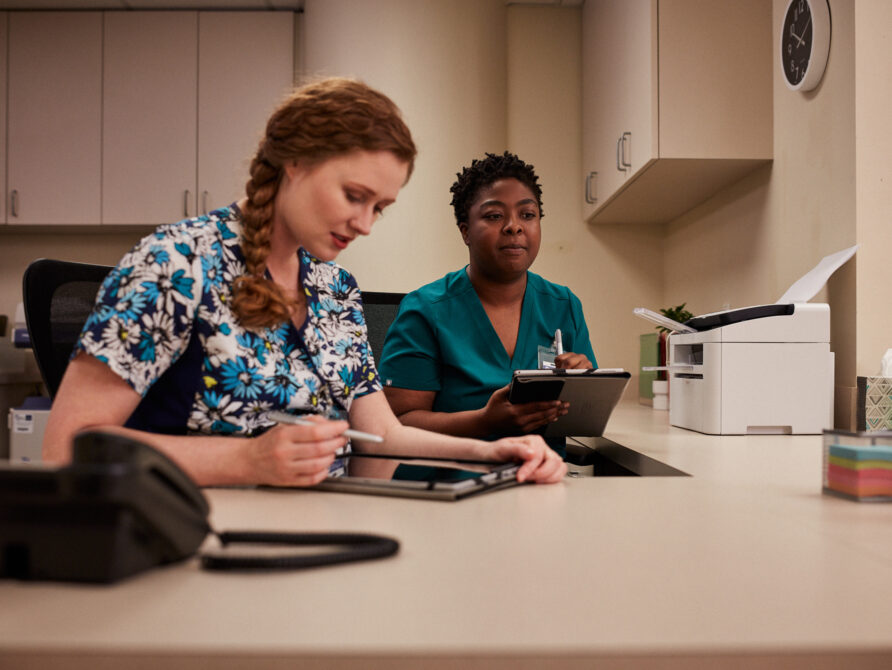 Image of healthcare professionals using EHR tools