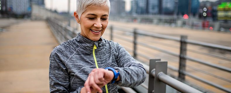 Image of woman with wearable AI technology (smart watch)