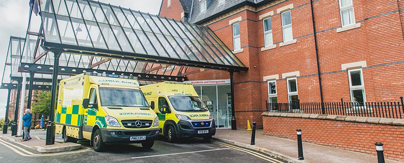 Image of ambulance trucks at hospital
