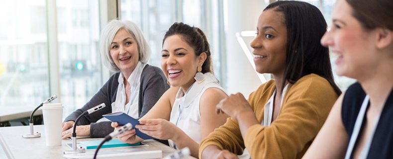 Health informatics professionals at meeting.