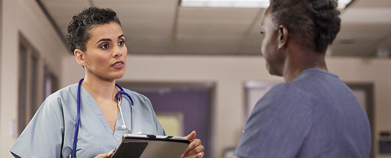 Two nurses conversing.