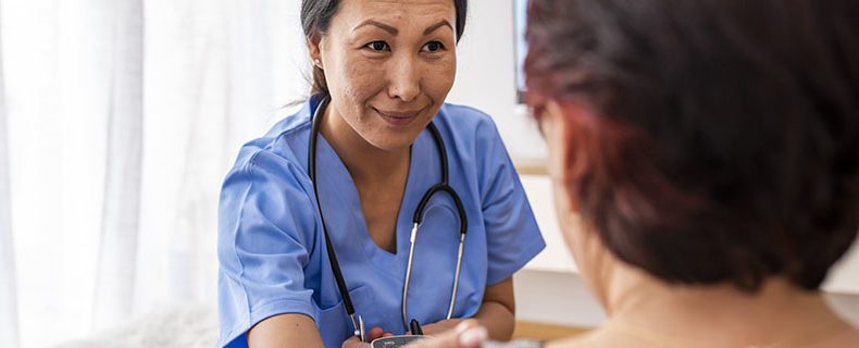 Nurse taking care of senior patient.