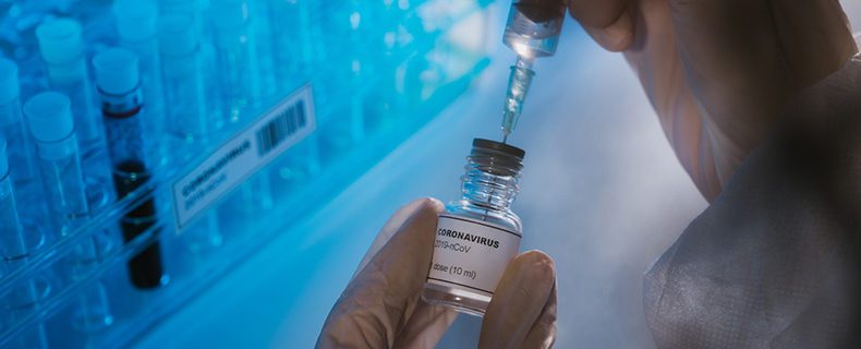 Doctor preparing COVID-19 vaccine.