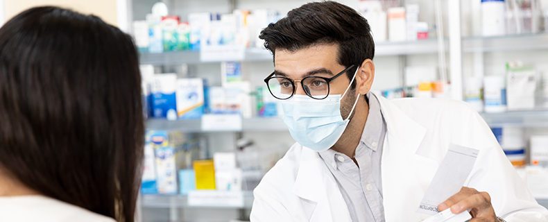 Pharmacist interacting with patient.