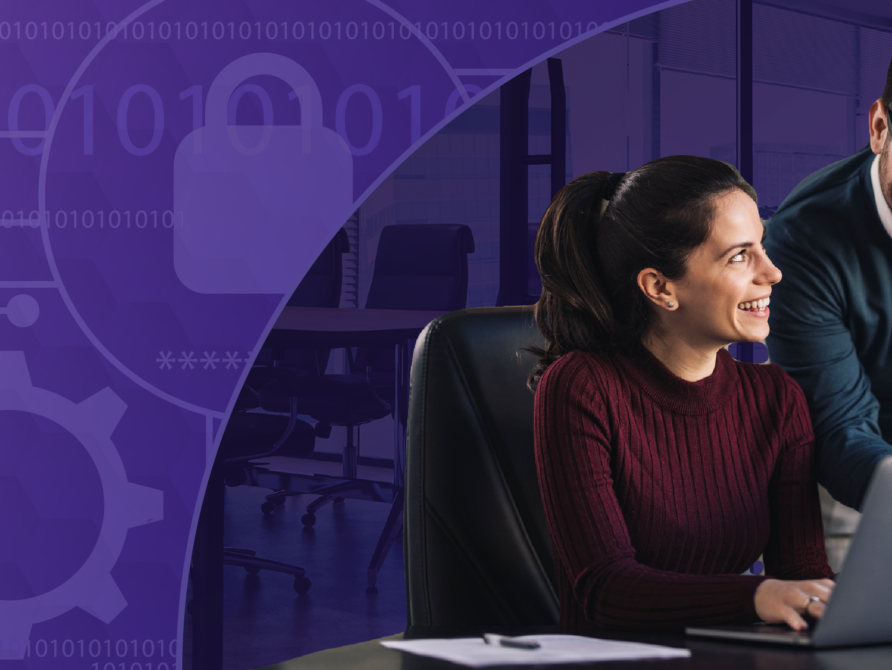 Two physicians at a computer using EHR.