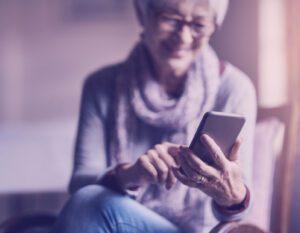 Woman on EHR software on phone