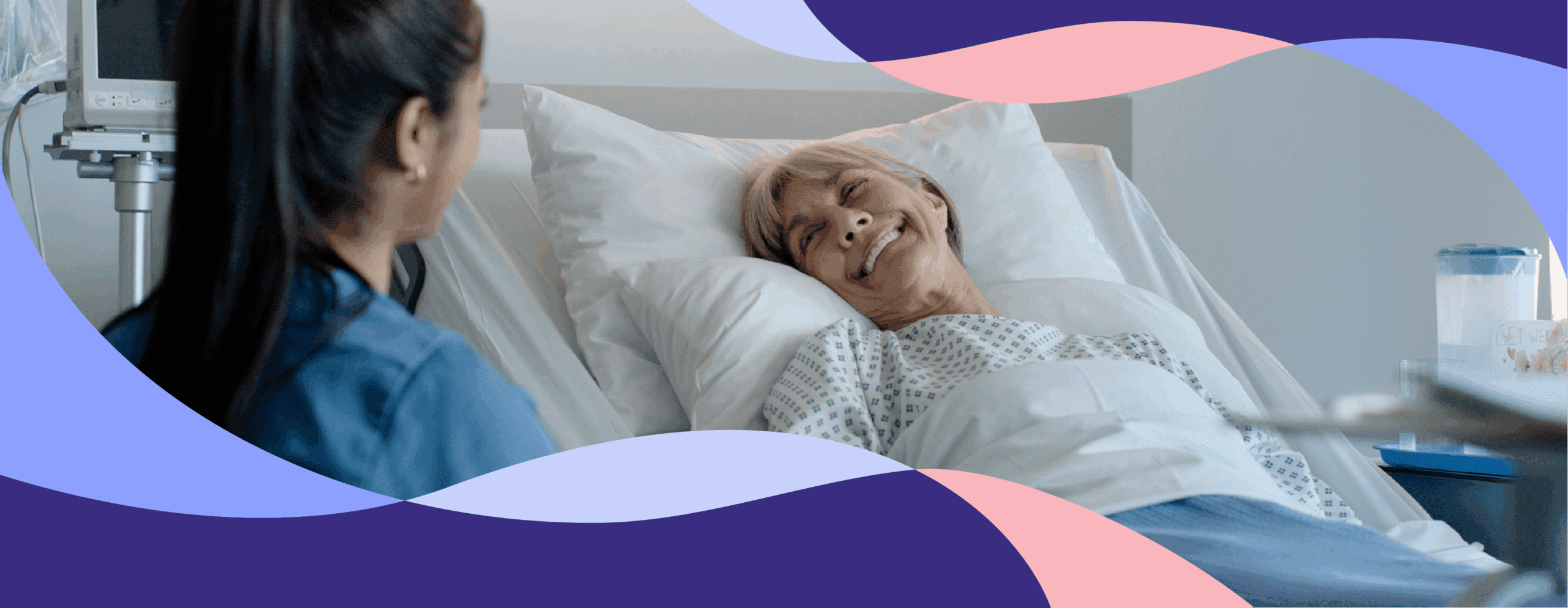 Nurse talking to patient in hospital bed