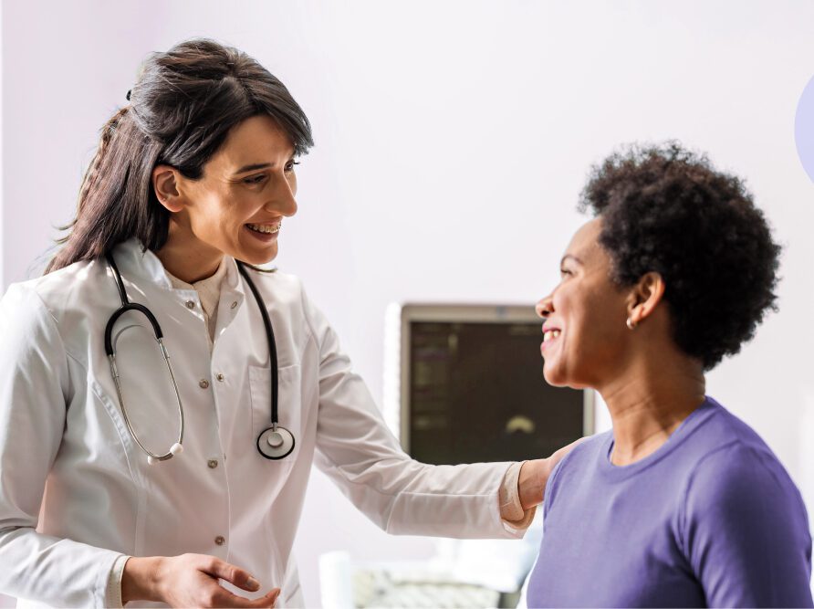 Doctor talking to patient in hospital