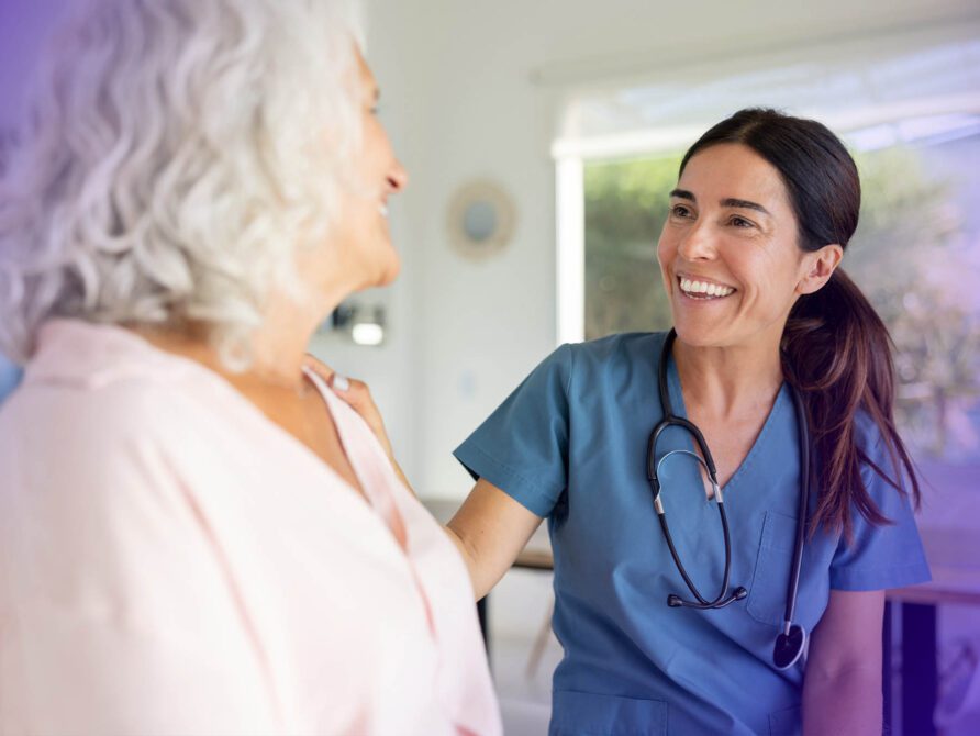 Nurse talking to patient in hospital