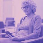 woman on phone in hospital waiting room