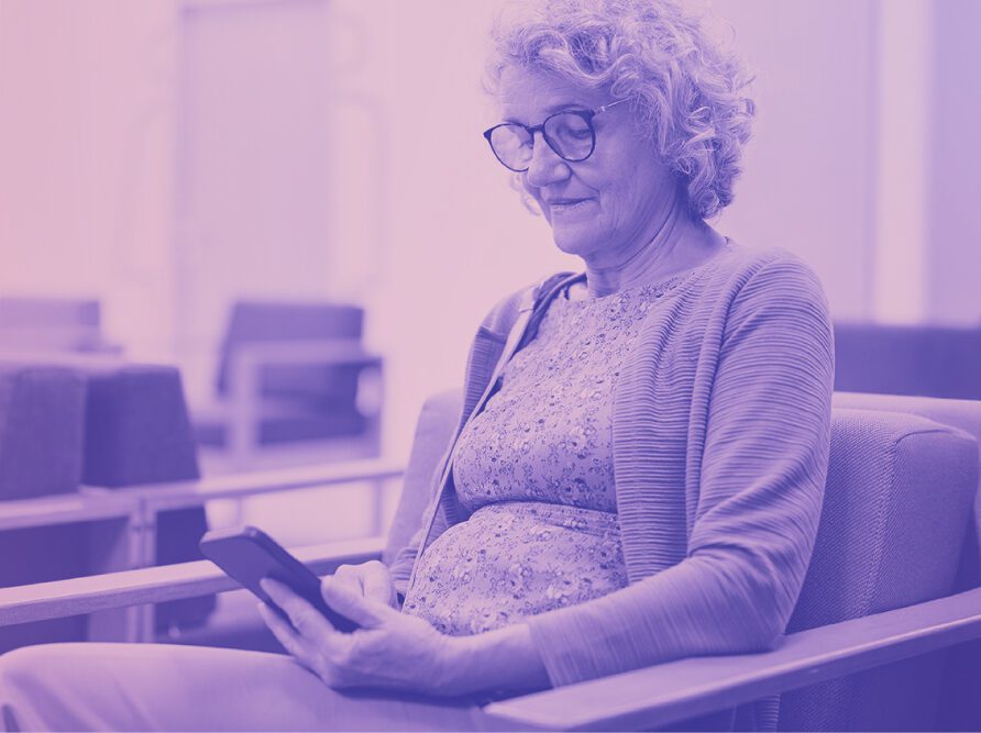 woman on phone in hospital waiting room