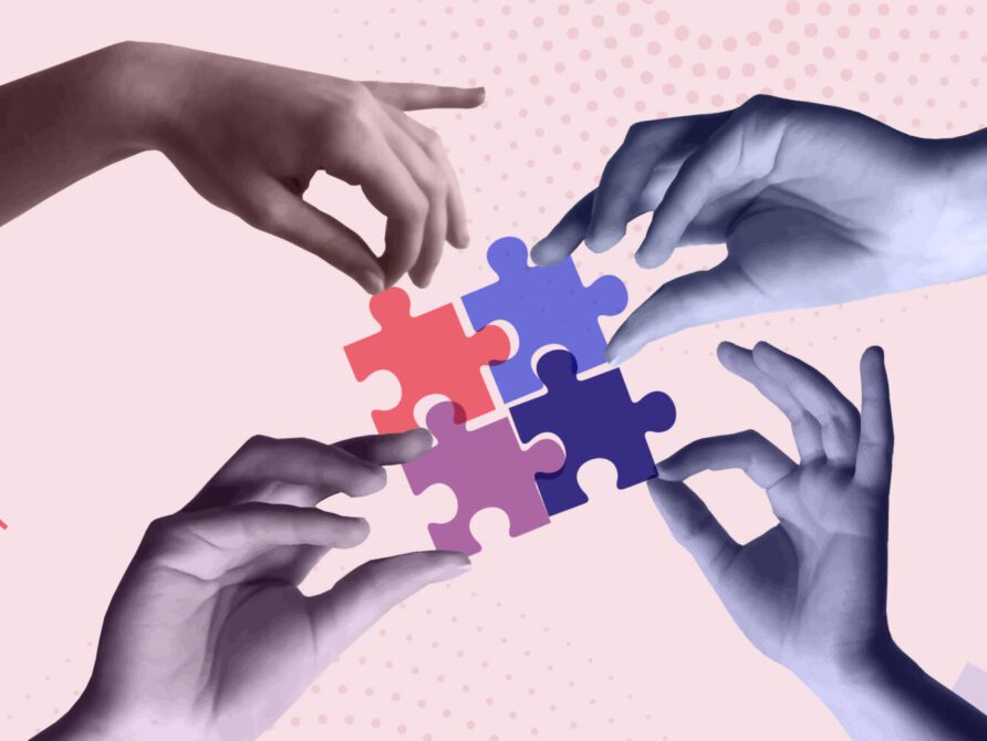 hands putting puzzle pieces together