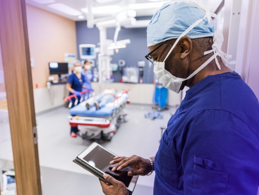 Doctor looking at EHR on tablet