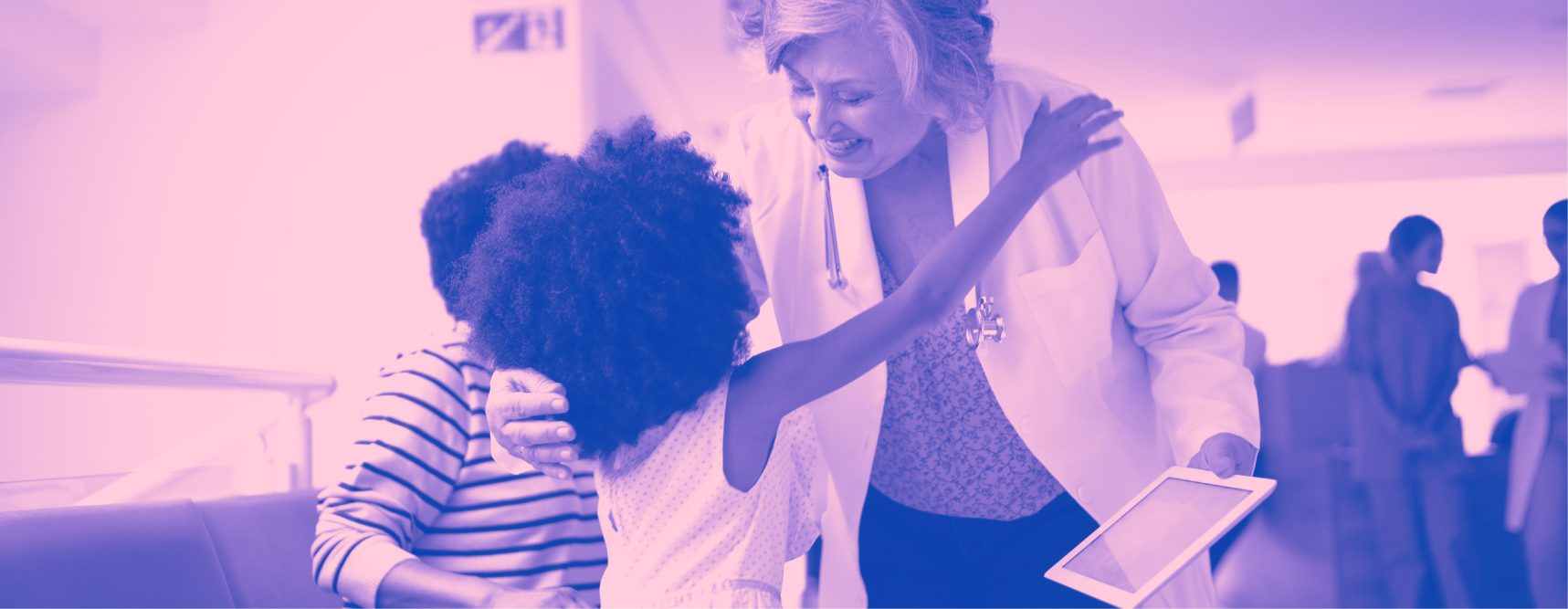 doctor hugging child who is a patient