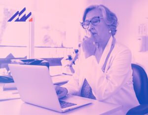 Doctor at computer using AI EHR software