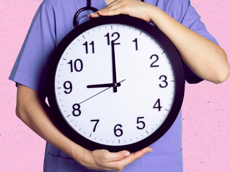 person holding large clock